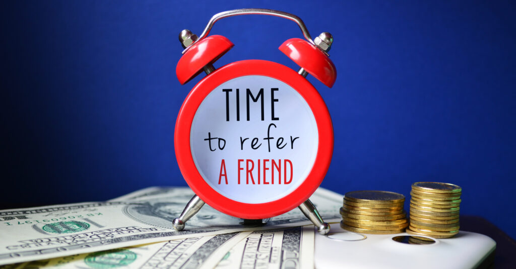 A clock with the words 'Time to refer A FRIEND'.