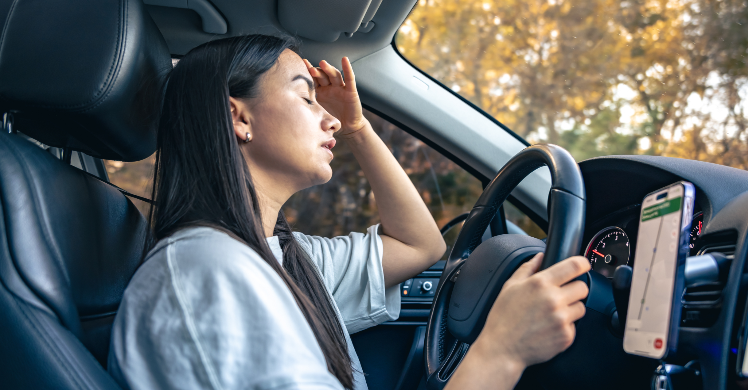 An Upset Young Woman In A Car.